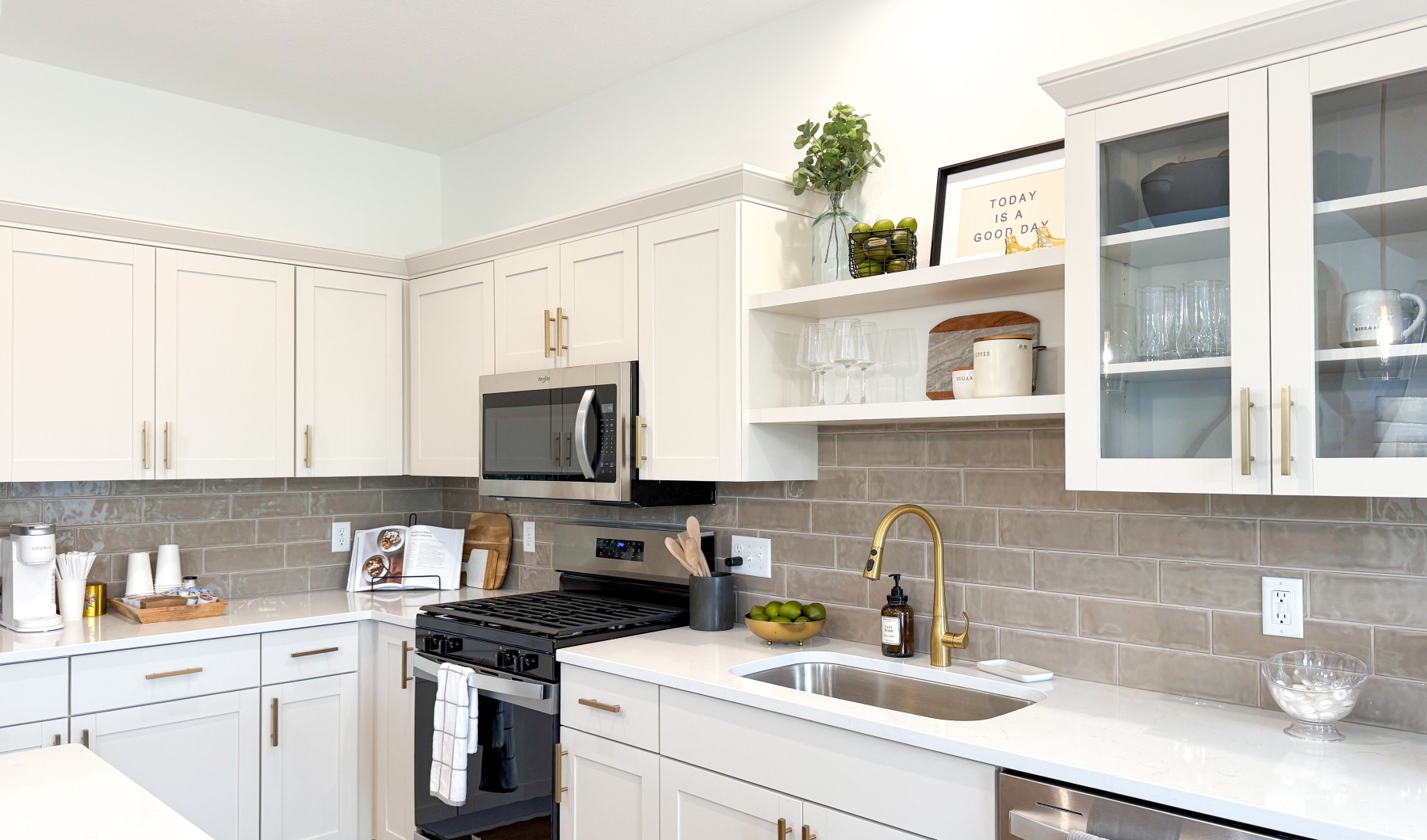 Woodhelm Townhomes kitchen with backsplash, gold accents, and lots of storage