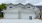 Woodhelm Towhnomes Exterior with natural stone gables  corbels windows two car garage